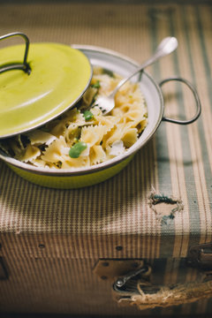 a pot of pasta with peas and ricotta cheese