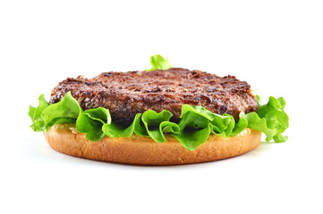 Base of classic cheeseburger: bun, salad, beef cutlet. Isolated on white background. 