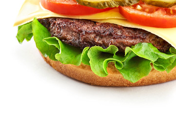 Classic cheeseburger isolated on white background. Close-up view.
