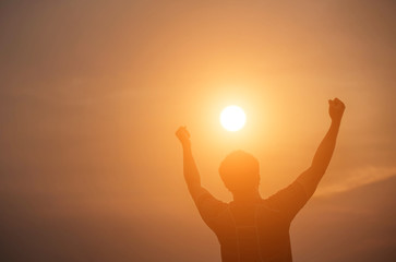 Man show hands silhouette sunset background 