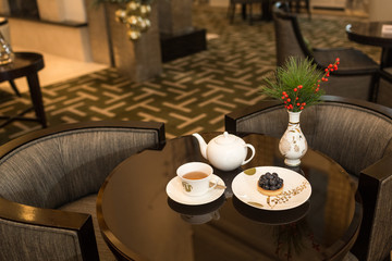 Tea and dessert on table