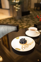 Tea and dessert on table