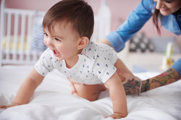 Fototapeta premium Sweet baby boy start crawling