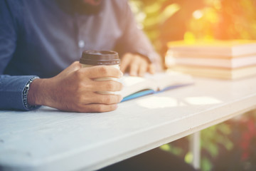 Young man reading book. Learning or Education concept.