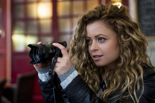 Woman using digital camera