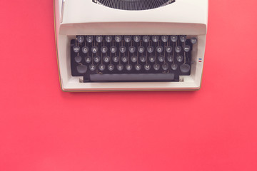Flay design of typewriter on red background. Retro style.