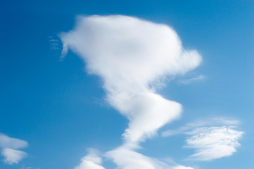 white fluffy clouds in the blue sky background texture.