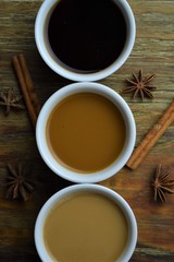 White coffee cups on wood background