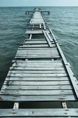 Obraz premium Wooden pier on the sea background