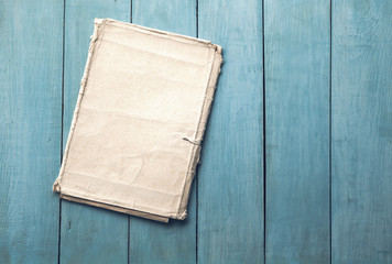 Naklejka na ściany i meble folder on blue wooden background