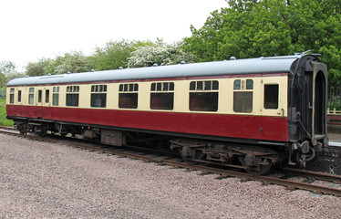 Fototapeta na wymiar A Vintage Railway Train Carriage Standing at a Platform.