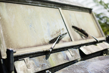 Abandoned old rusty car. Retro background