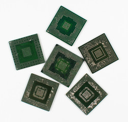 Ball Grid Array (BGA) chips badly desoldered and ruined. Consequences of unskilled repair - pins are fused and flooded with molten solder.