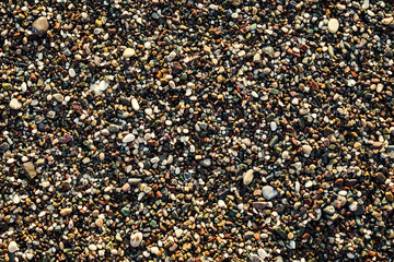 stones and sea,Pebble beach texture,wall pattern of gravel stone,pebbles on the beach as background,Gray sea pebbles on sand background,travel concept,Turkey,Florida,Miami