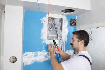 Electircian Installing Electrical Panel   