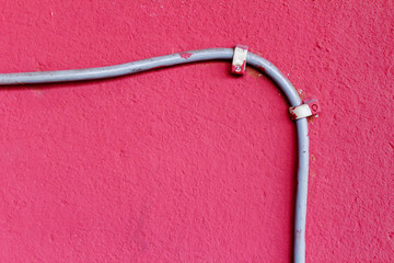 Ethernet cable attached to the wall. Abstract background
