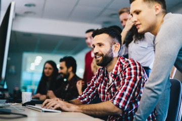 Obraz premium Programmers cooperating at information technology company
