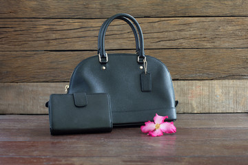 Handbags and wallets women on old wooden table / selective focus