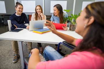 Executives interacting with each other in conference room
