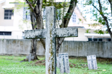 Old grey tombstones. Cemetery in Malaysia
