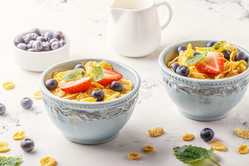 Healthy breakfast - corn flakes with fruits and berries.