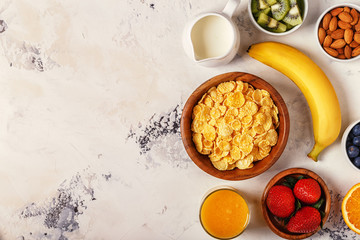 Healthy breakfast - bowl of corn flakes, berries and fruit © tbralnina
