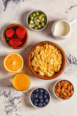 Healthy breakfast - bowl of corn flakes, berries and fruit