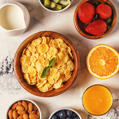Healthy breakfast - bowl of corn flakes, berries and fruit