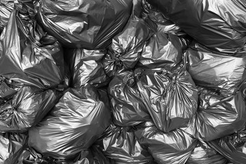 A pile of black garbage bags.