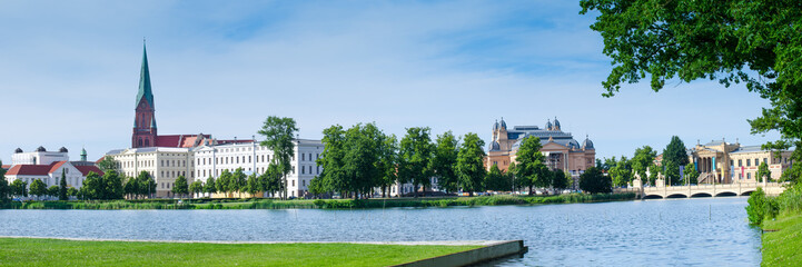 Obraz premium Schwerin with St. Mary's Church, theater, and Museum in the summer as a panorama