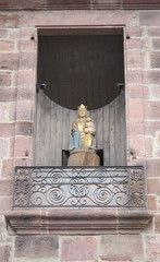 Mary statue in the wall of a church. France