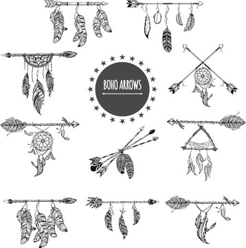 Tribal arrow set in ethnical pattern with feathers, and wild flowers