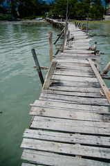 Wooden pier on the sea background