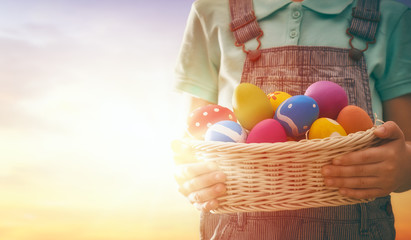 child hunts for Easter eggs