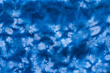 Pattern of blue dye on cotton cloth, Dyed indigo fabric background and textured