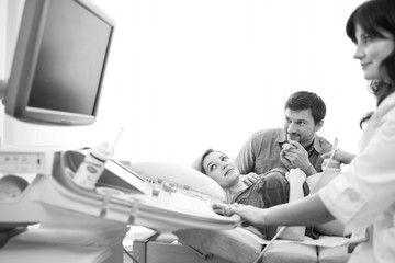 Fototapeta premium Monochrome shot of a loving pregnant couple at the hospital 