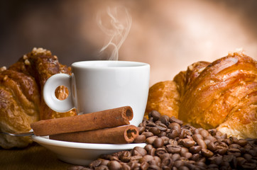 coffee cup with beans on wooden table