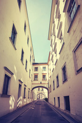 Old narrow street in Vienna, color toned picture, Austria