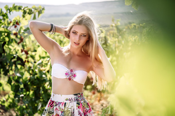 Naklejka na ściany i meble Young beautiful woman in tuscany vineyard
