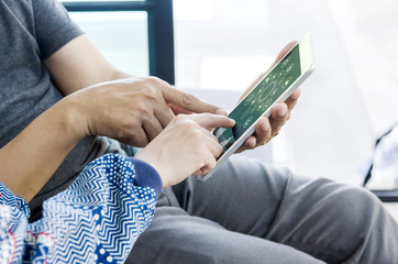 Close up hands of team dicussing something with paper work in office.