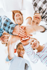 Children keeping their hands piled