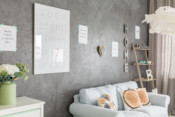 Room with grey walls and letters