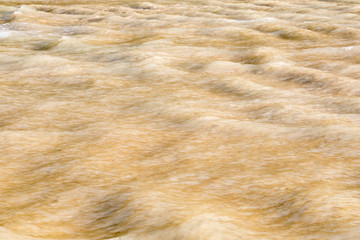 Motion blurred beach waves.