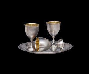 Silver tableware on black background