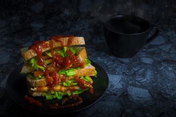 Sanwich chicken breast with cheese hotdog and vegetable (green oak) in dark background.