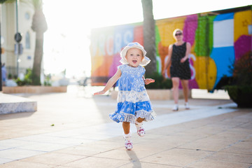 Little girl joyfully runs