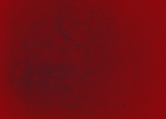 Dark red texture or background with a spray of paint