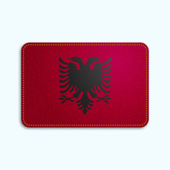 National flag of Albania with denim texture and orange seam. Realistic image of a tissue made in vector illustration.