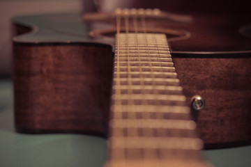 Fototapeta premium detail of classic guitar with shallow depth of field
