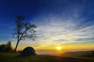 Fototapeta premium Watching the sunset in tent.